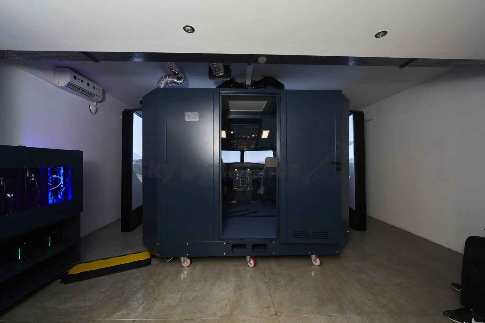 SkyDynamics FNPT II flight training device enclosure in simulator bay