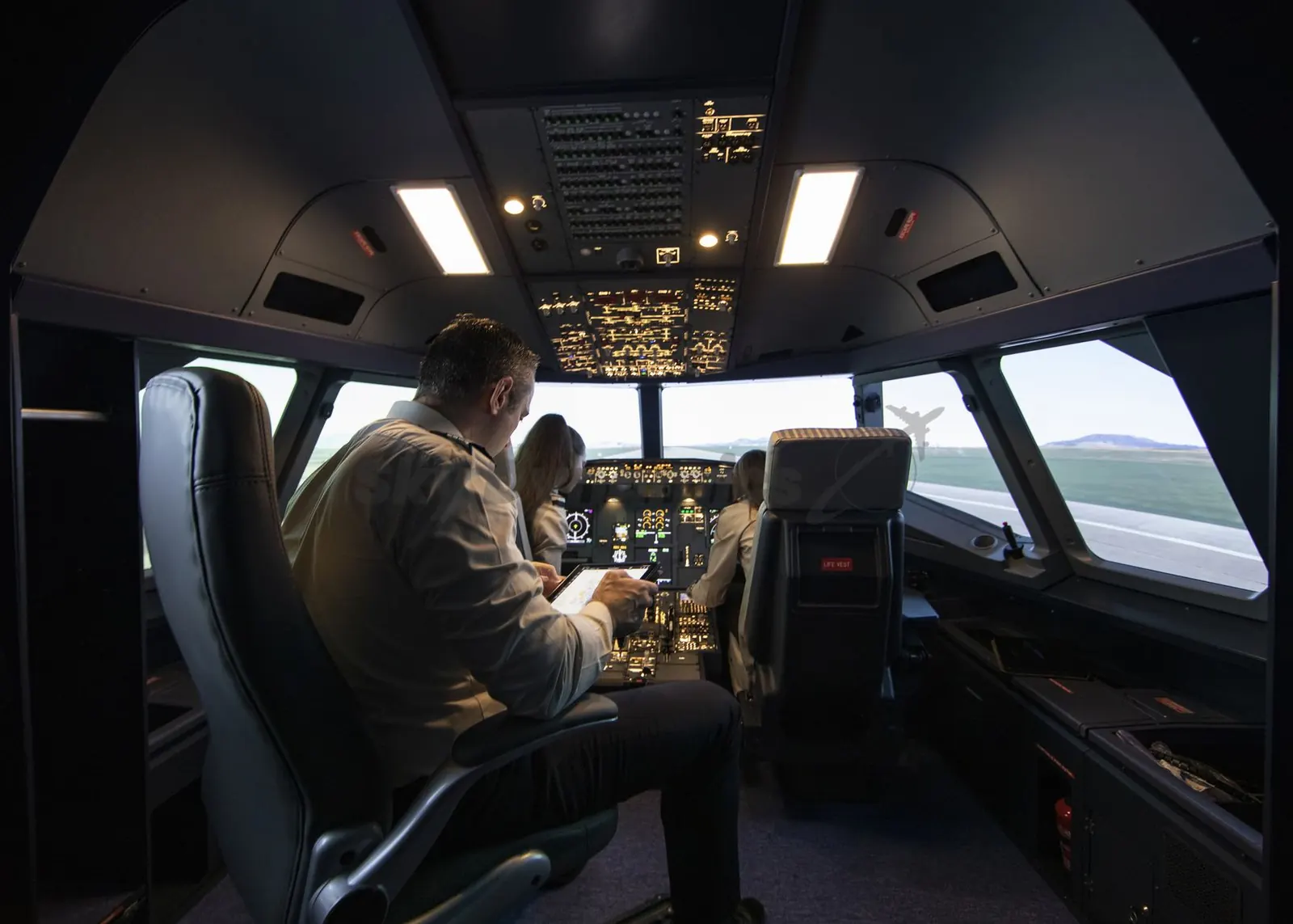 Airbus A320 FNPT II simulator: pilot seats and controls